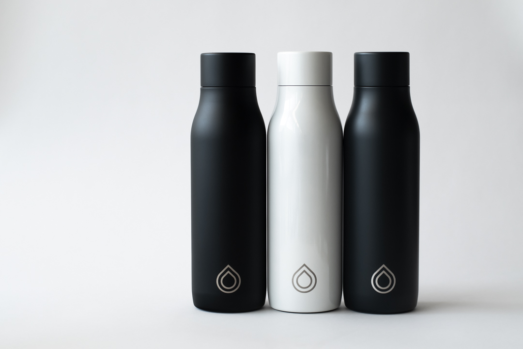 A photo of three Lyvecap bottles in black, white and grey. 