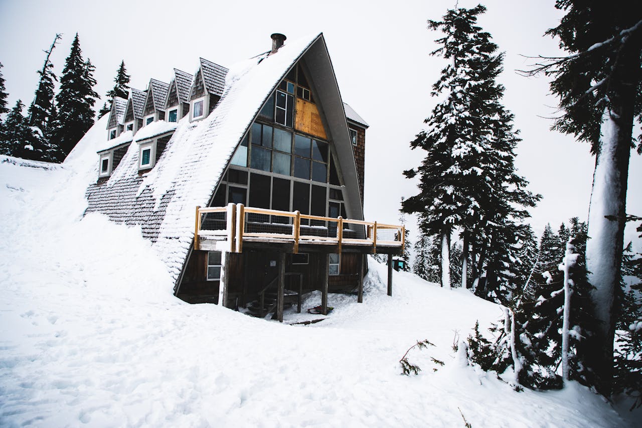 a chalet covered in snow