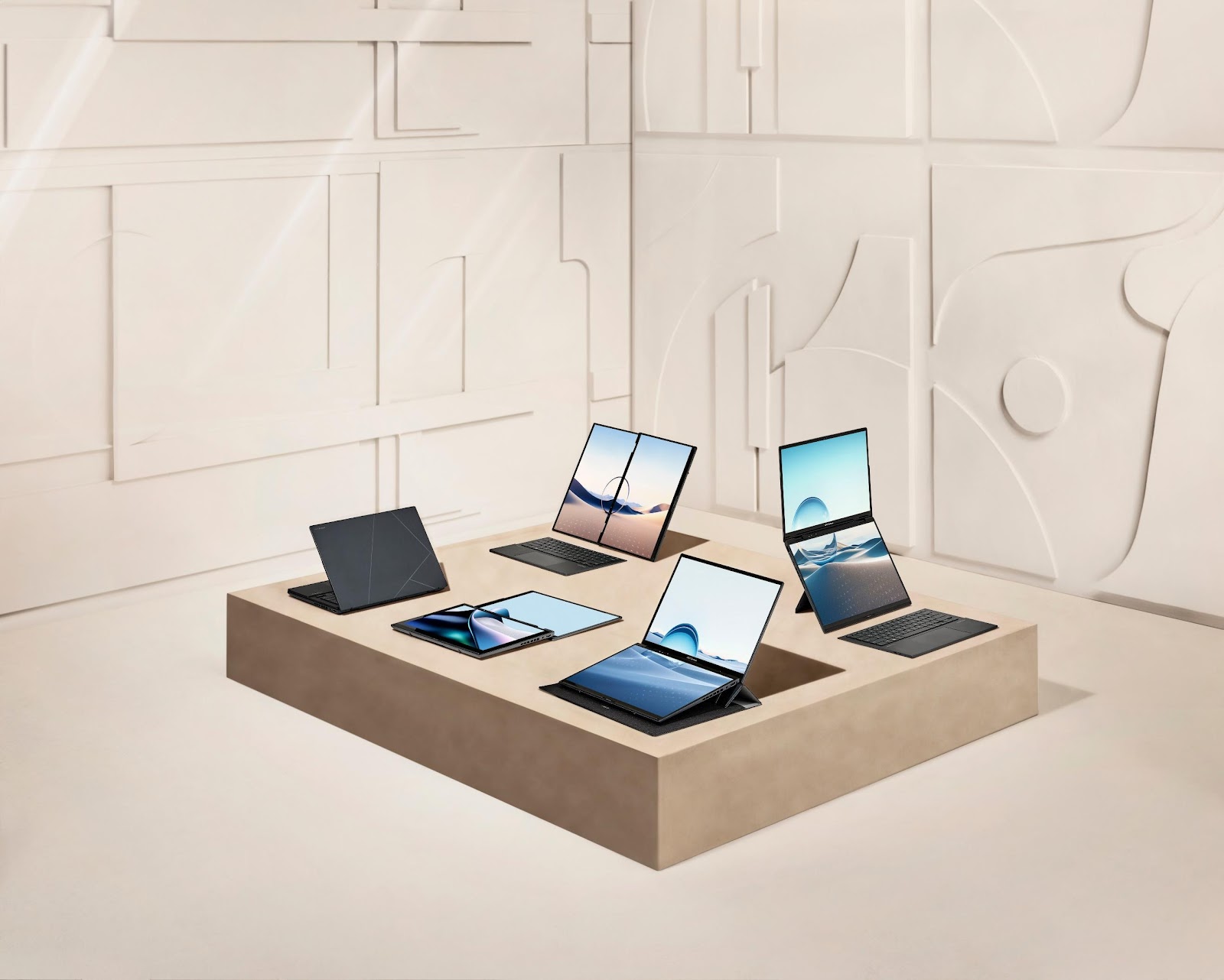 A group of laptops and tablets on a square table

Description automatically generated