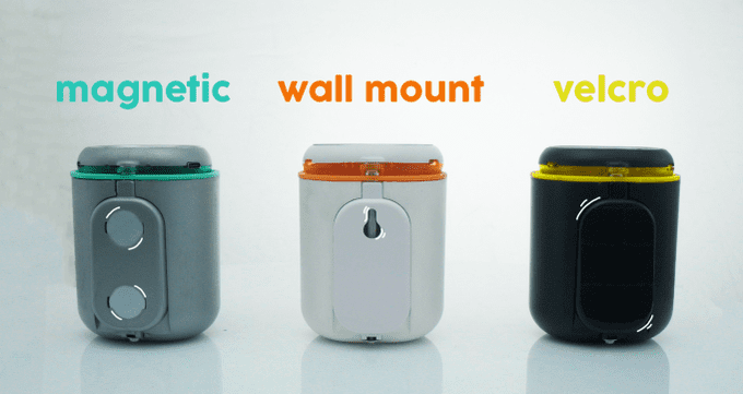 Three different PICO devices in the colours grey and cyan, white and orange, and black and yellow. Each device offers a different way to mount - by using magnets, or wall mounting, or velcro