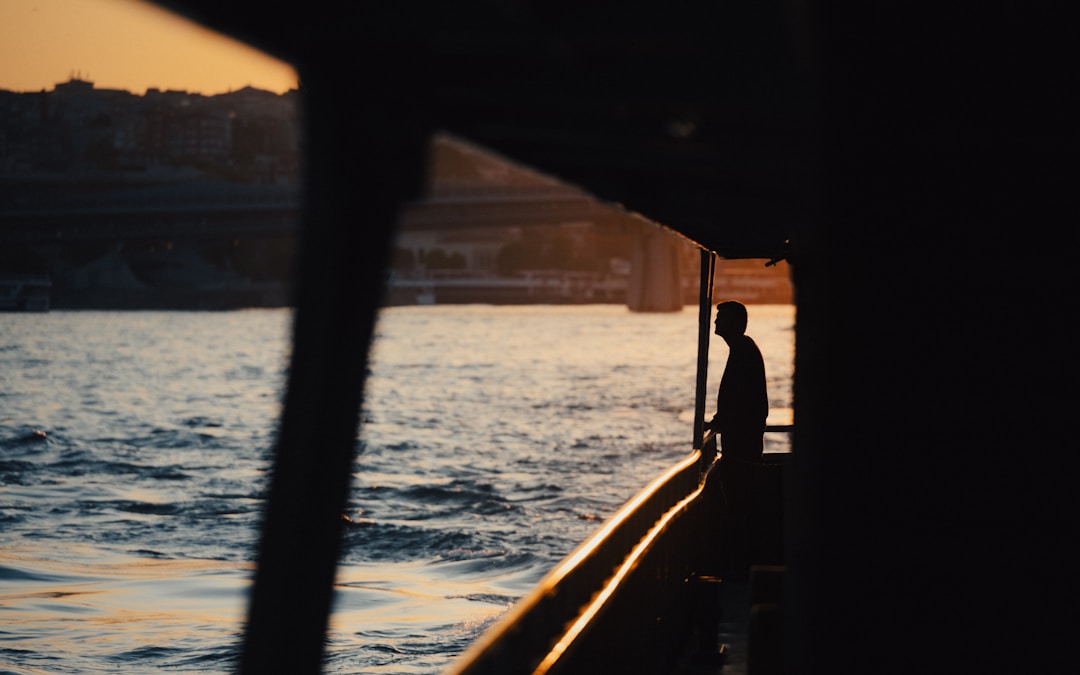 man looking out in the ocean