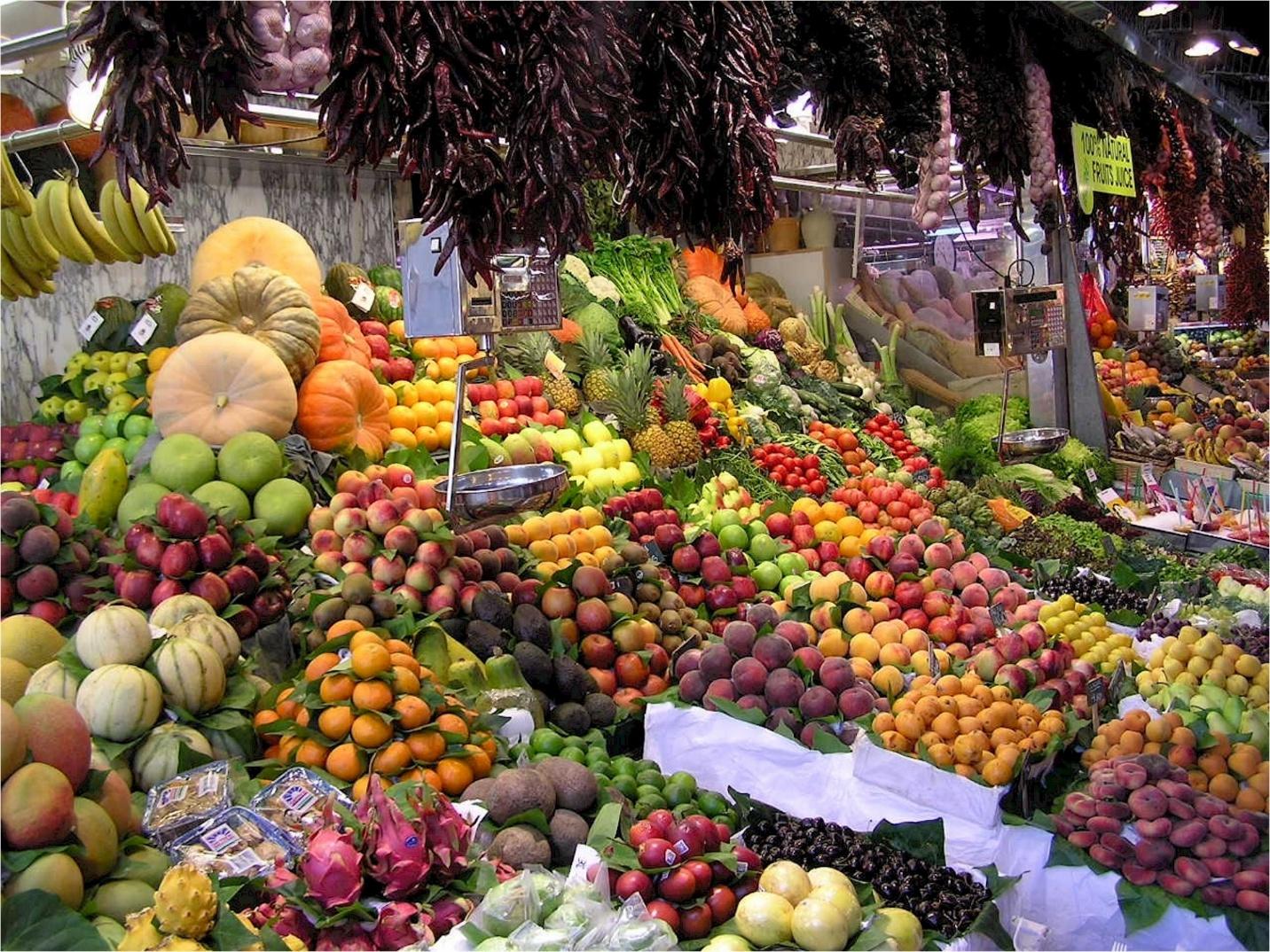 A large display of fruits and vegetables

Description automatically generated