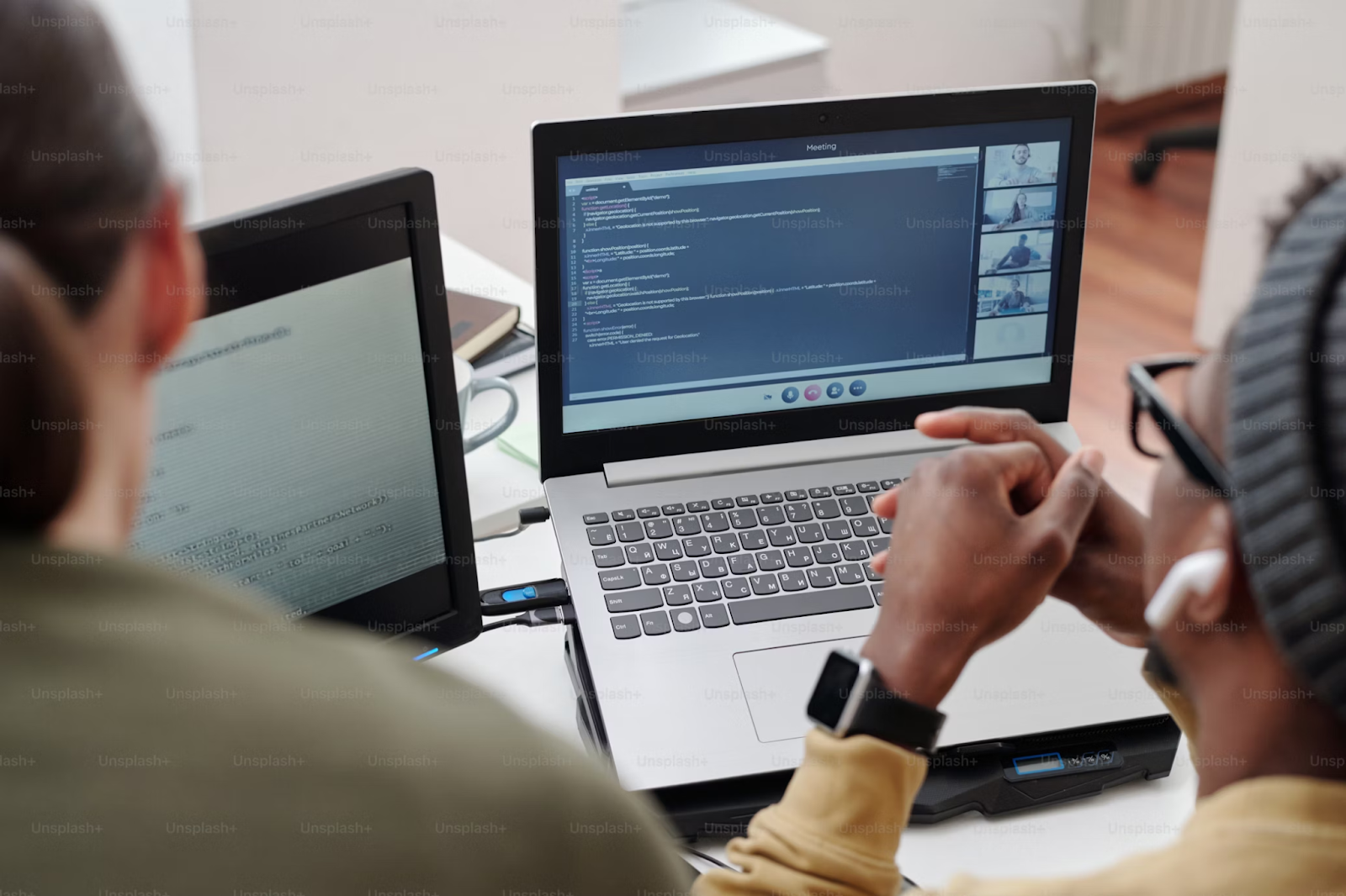 developers looking at a laptop