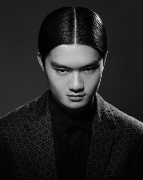 Picture of a  man with  Clean Middle Parting and Slicked Sides