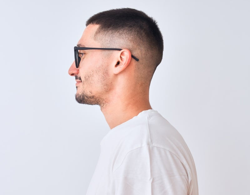 Side view of a guy wearing the side buzz cut fade