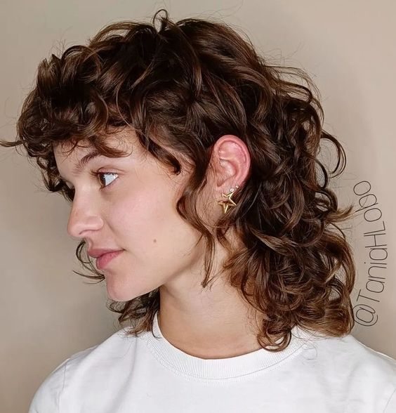 Picture of a lady wearing the Wolf Cut for Women with Curly Hair