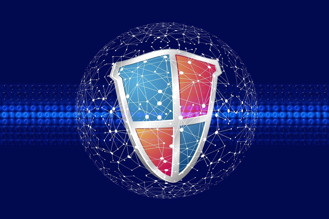 A digital illustration of a shield with network connections against a blue background with binary code, featuring interconnected nodes and lines.