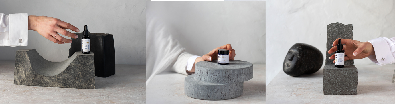 A hand holding a small container on a round concrete object

Description automatically generated