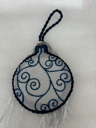 A blue and white ornament

Description automatically generated