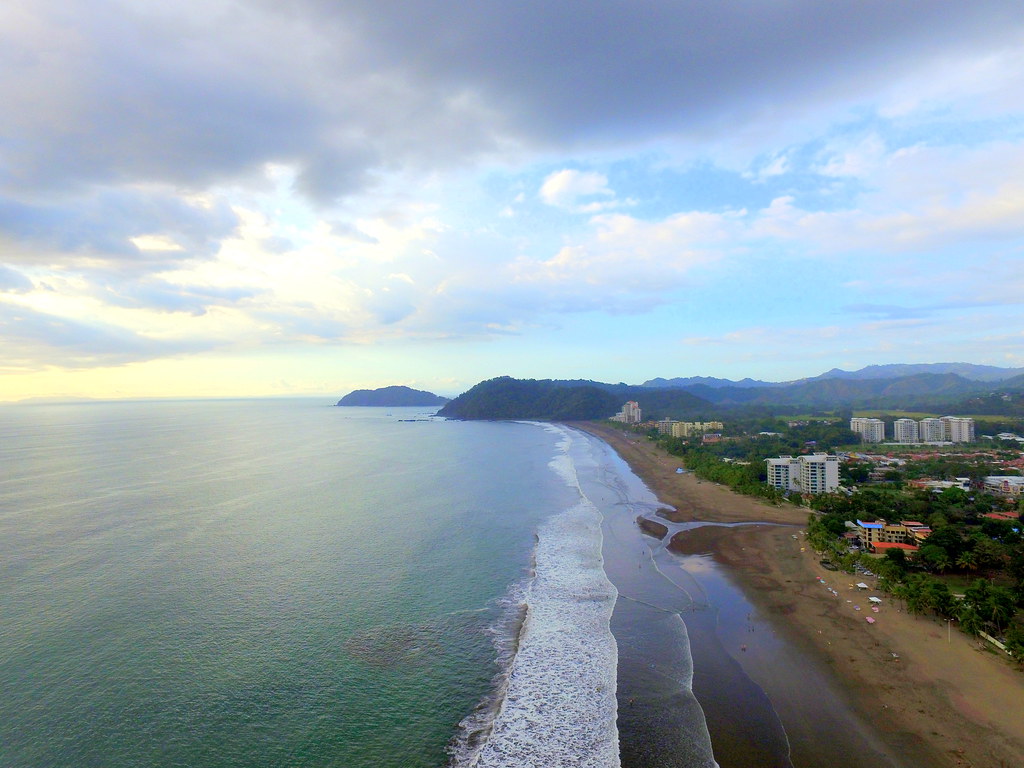 pristine beach and city view in one of the best beaches in Costa Rica