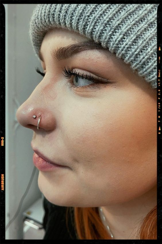 Different types of nose piercing: Picture of a lady wearing the cute blings