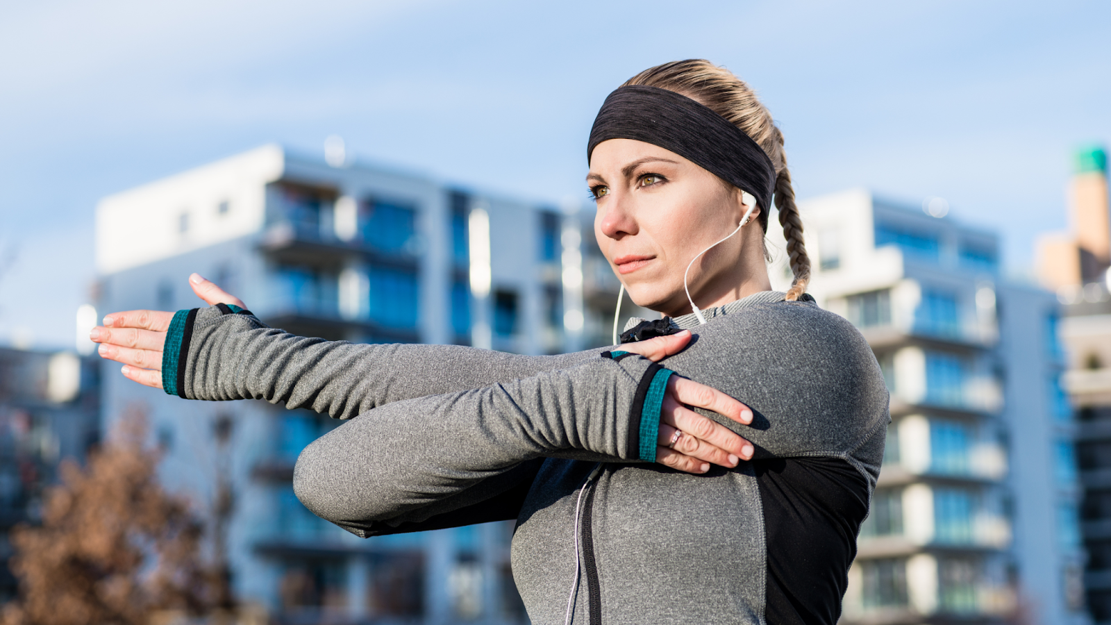 a woman doing static arm stretches