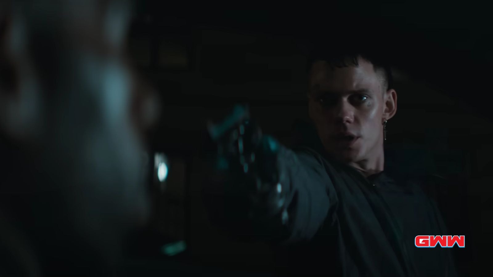 Bill Skarsgård as Eric, pointing a gun in The Crow 2024 Trailer