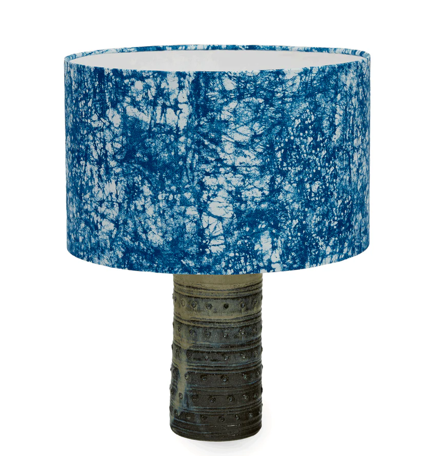 African-style indigo lampshade with a Nigerian ceramic base