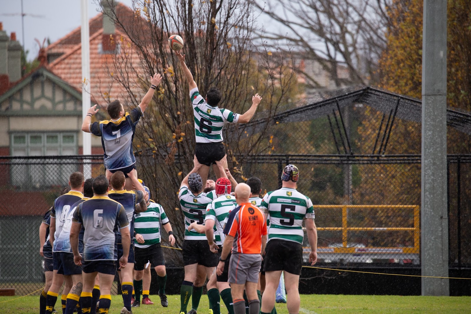 Players from the Melbourne Chargers and HMAS Cerberus compete for possession at a line-out.