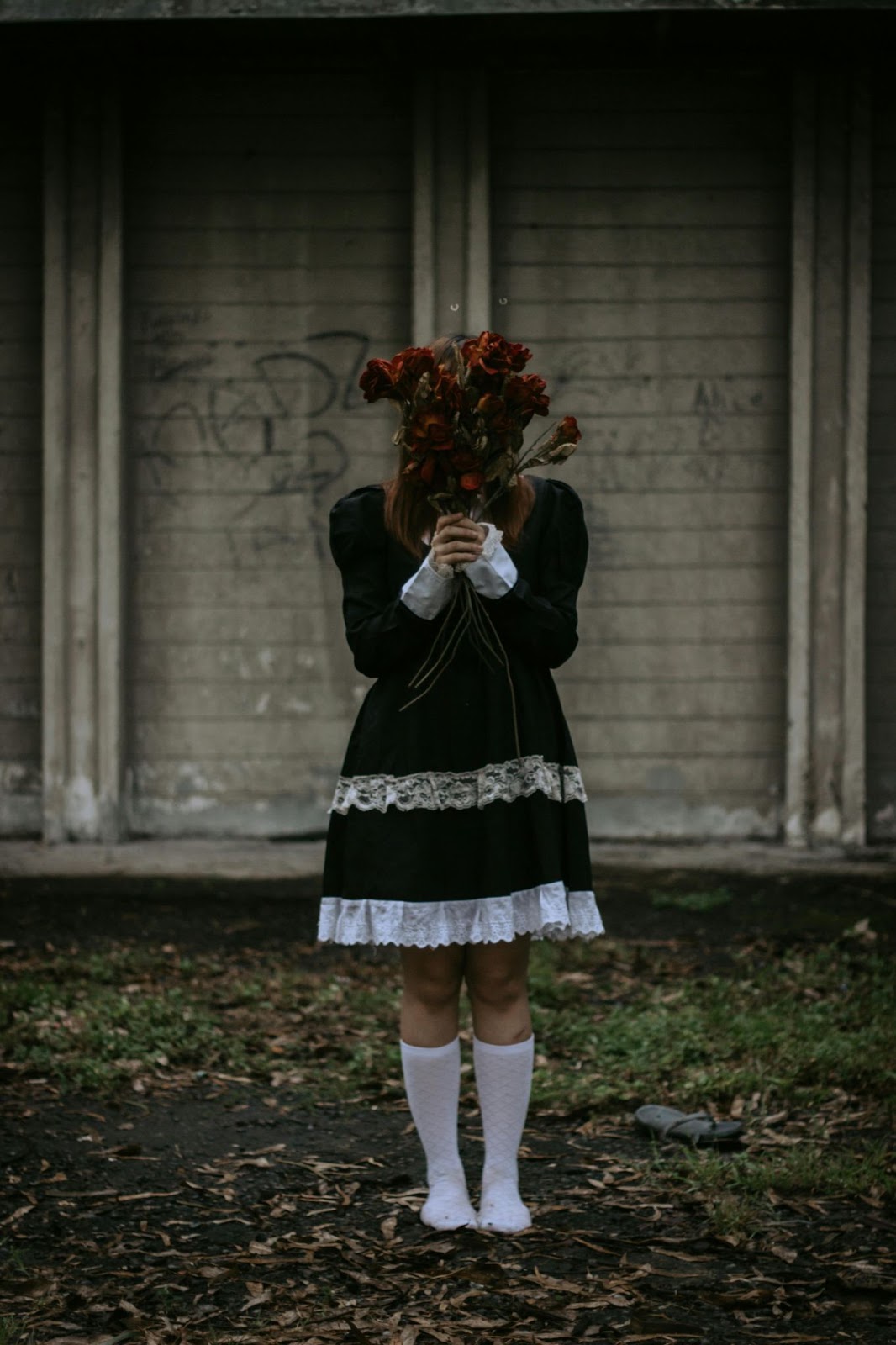 Hidden Face Flower Crown Girl DP
wearing a black dress