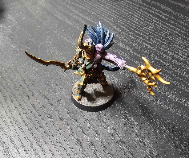 A toy figurine of a warrior with a spear Description automatically generated