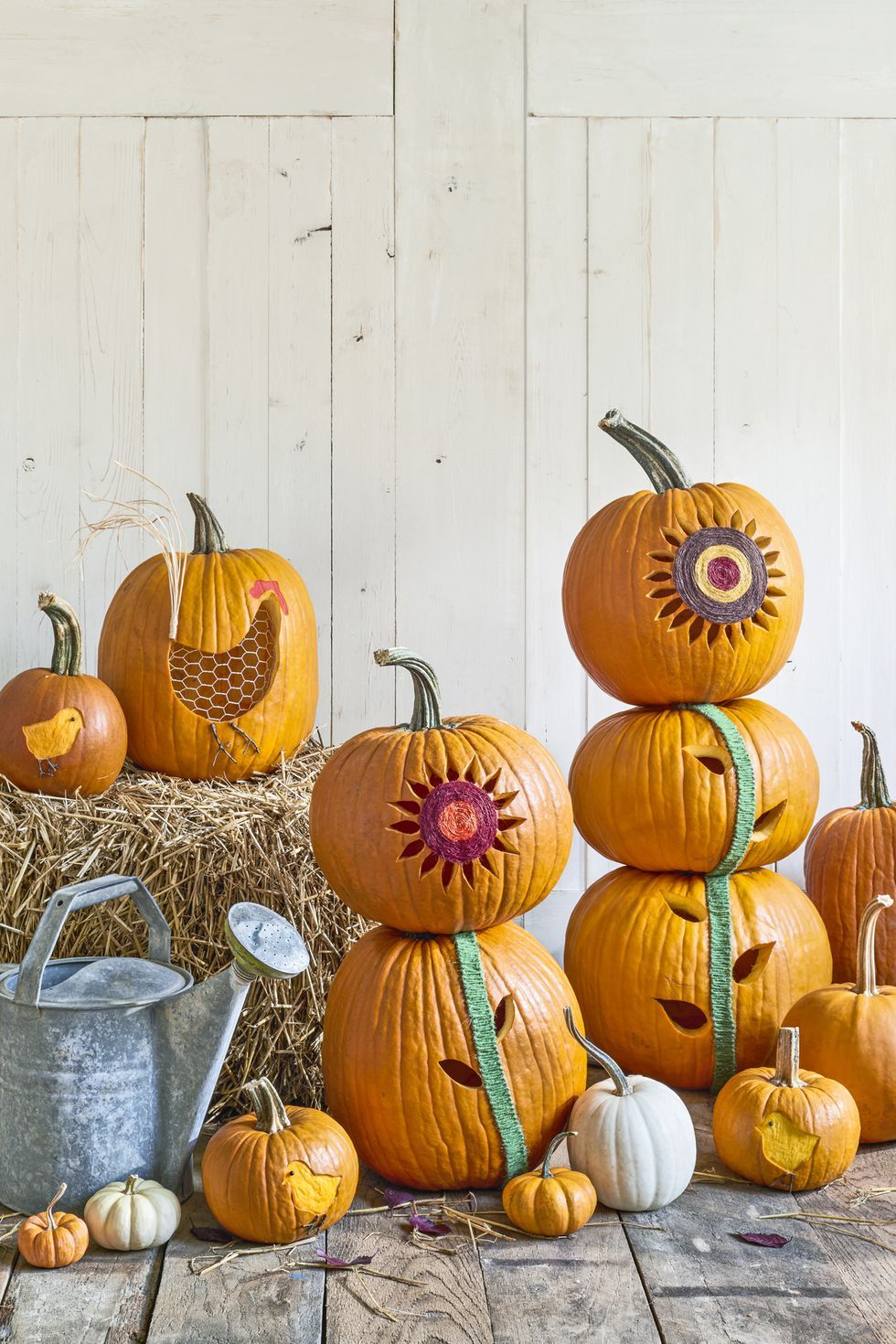 pumpkin carving ideas, stacked pumpkins carved with flower designs