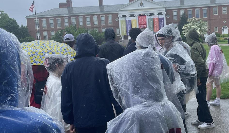  image of students  touring university in the rain                                                              