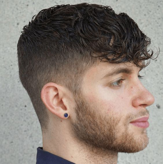 Side view of a guy rocking his long low taper fringe hairdo