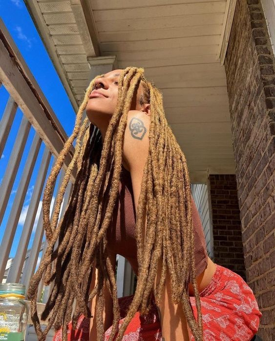 Picture of a lady showing off her iconic dreads