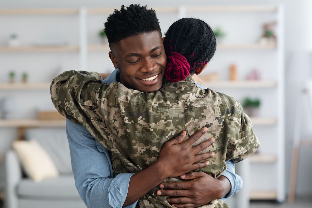 Soldier hugging her husband