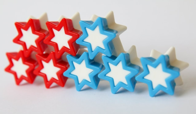 Red and blue stars stacked on a white background