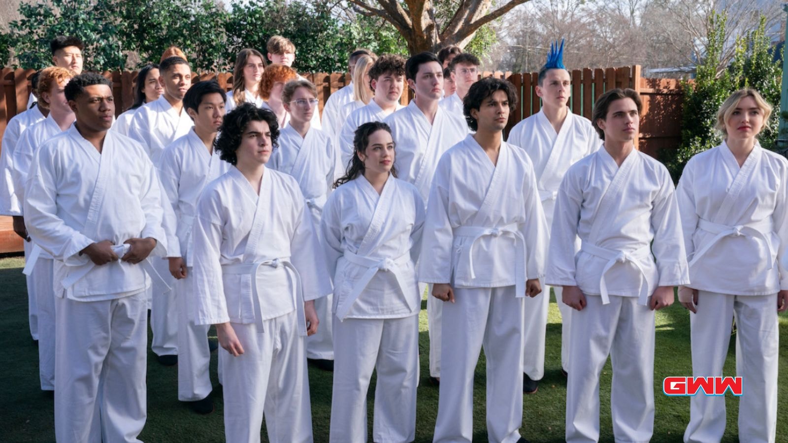Karate students gathered together in white uniforms,  Cobra Kai Season 6 Trailer 
