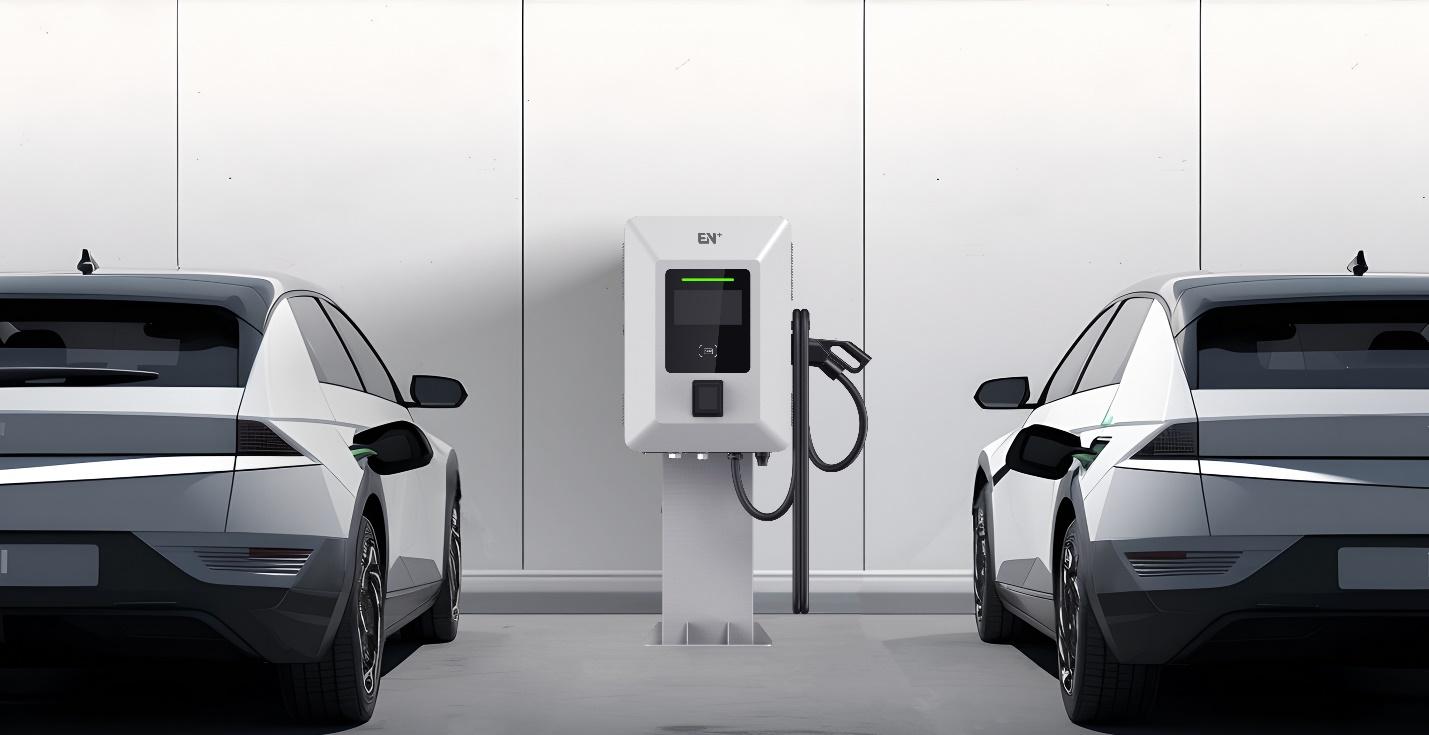 A couple of cars in a charging station

Description automatically generated