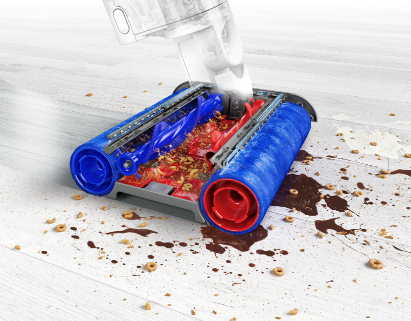 A vacuum cleaner with a blue and red rollerDescription automatically generated