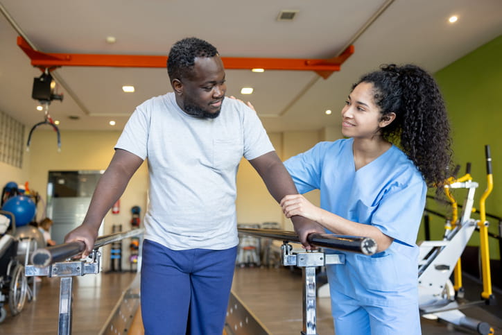 A therapist assisting a patient at a short-term rehabilitation.