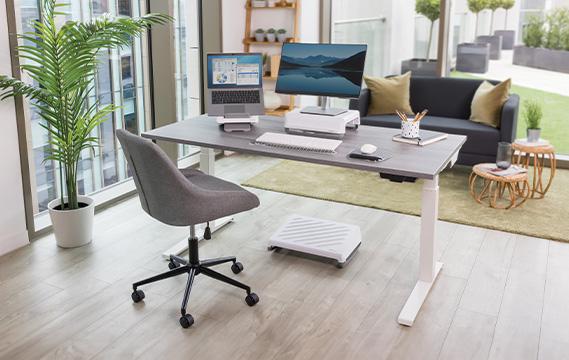 A desk with two computers on it

Description automatically generated