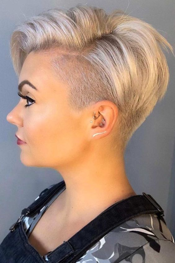 Side view of a lady wearing the pixie with an undercut