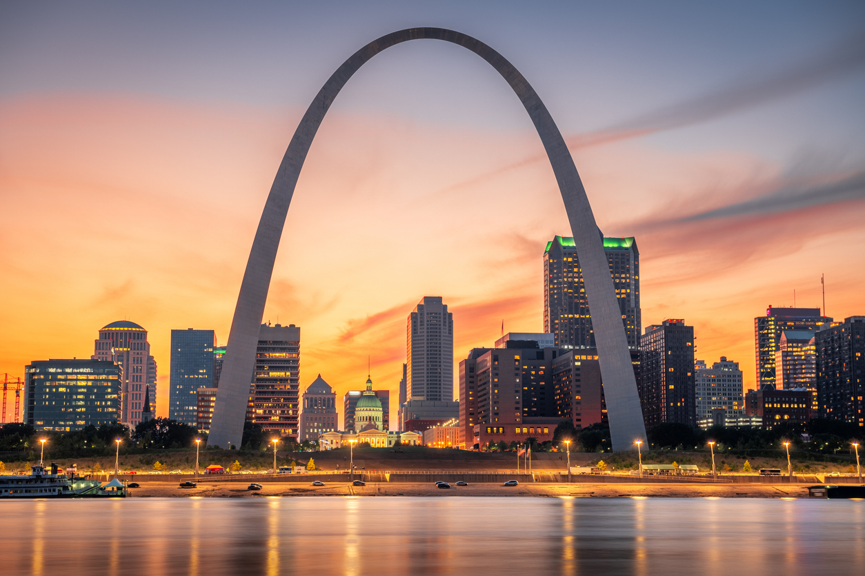The Gateway Arch in downtown St. Louis at sunset.