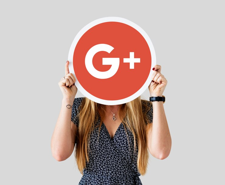 Woman holding a Google Plus icon