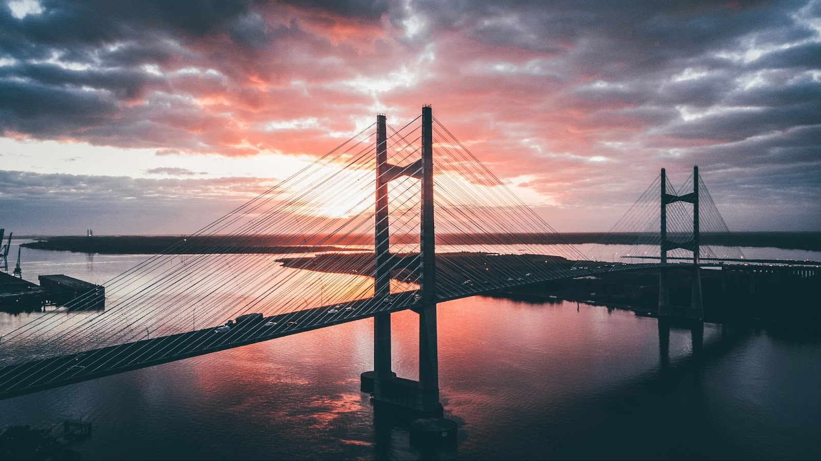 Dames Point Bridge gives a scenic silhouette in Jacksonville, FL, at sunrise.