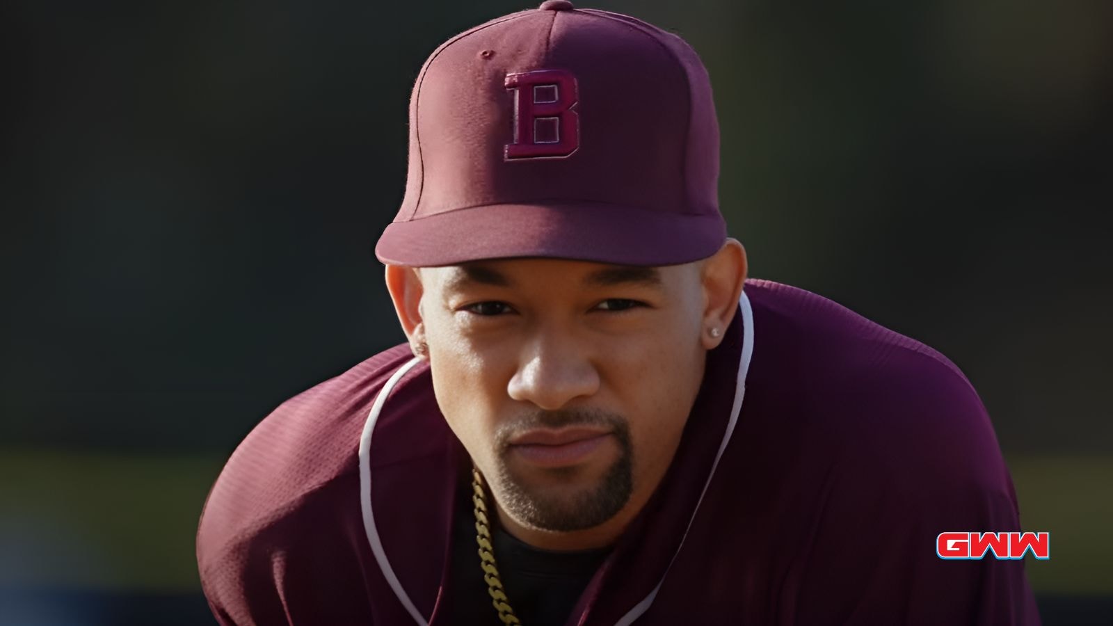 Close-up of focused Damon in maroon Lions uniform and cap.