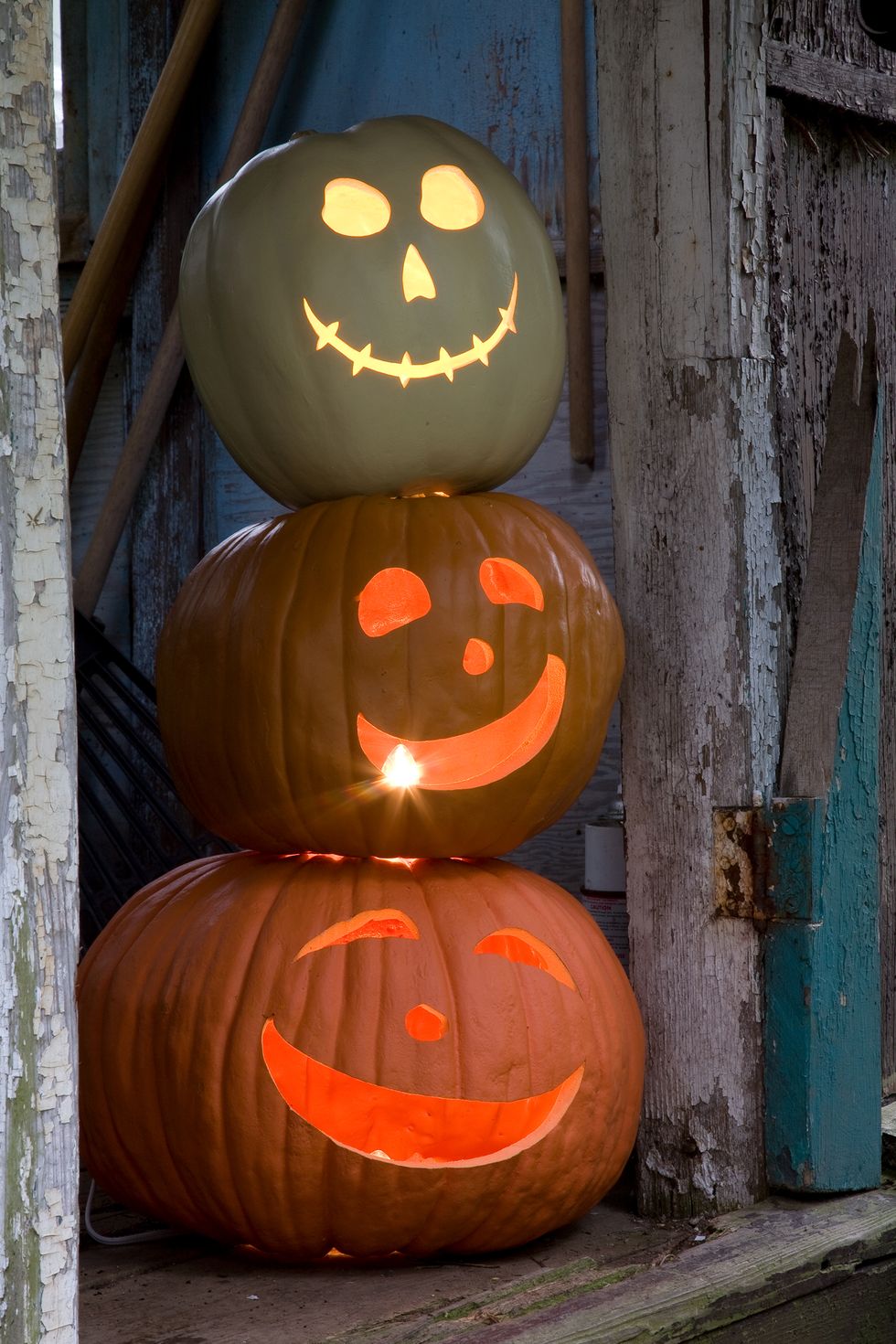 pumpkin carving ideas, two pumpkins stacked on top of each other with carved smiley faces