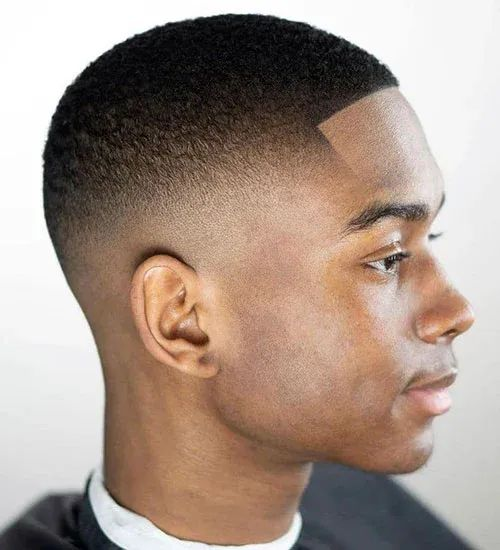 Side view of a man rocking the skin fade