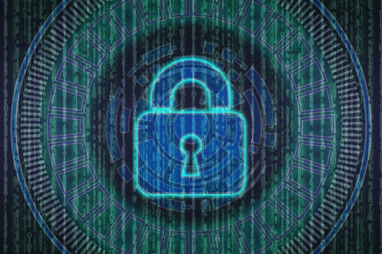 A digital illustration of a blue padlock surrounded by abstract circuitry patterns and green binary code in the background.