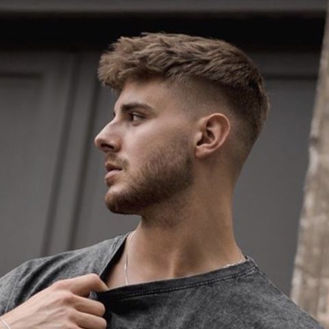 Picture of a man wearing his low taper fringe 