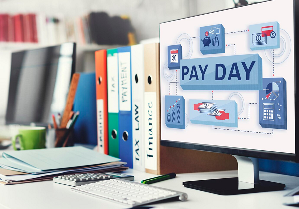Computer with Pay Day on Screen | FintechZoom