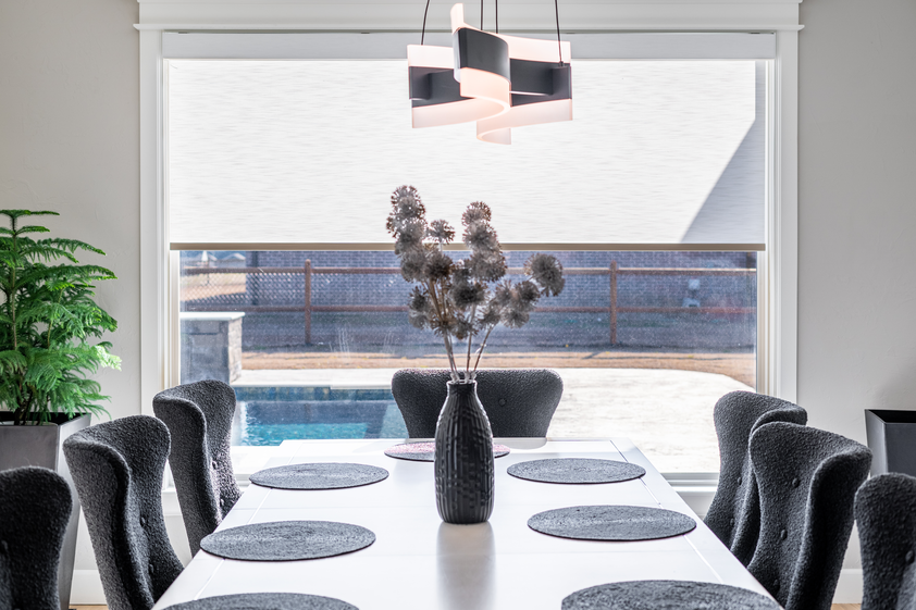 Flowers on table with pool in background