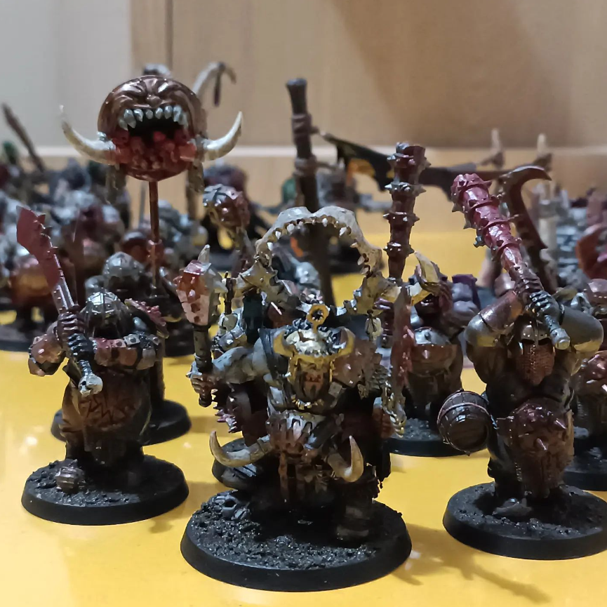 A group of small figurines on a table Description automatically generated