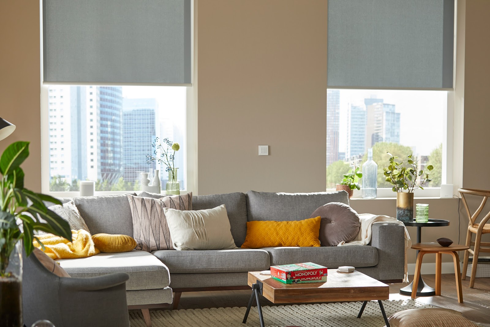 Living room with cordless motorized shades behind couch