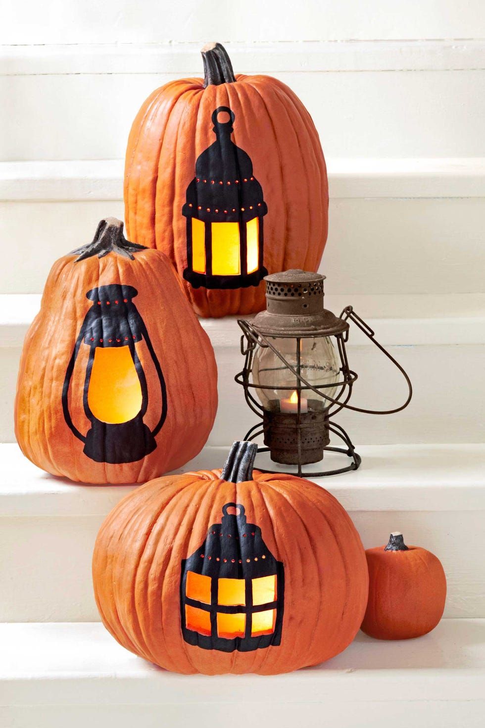 pumpkin carving ideas lamp jacko'lantern designed pumpkins on the white stairs