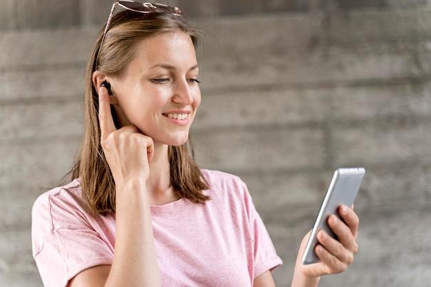 Smiley woman with mobile