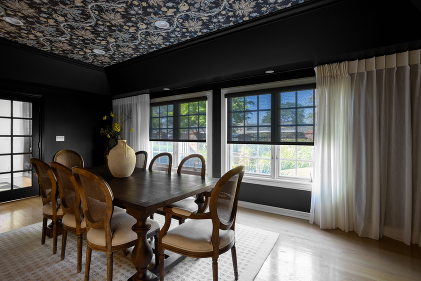 Bright room with dark wall coloring and light drapes