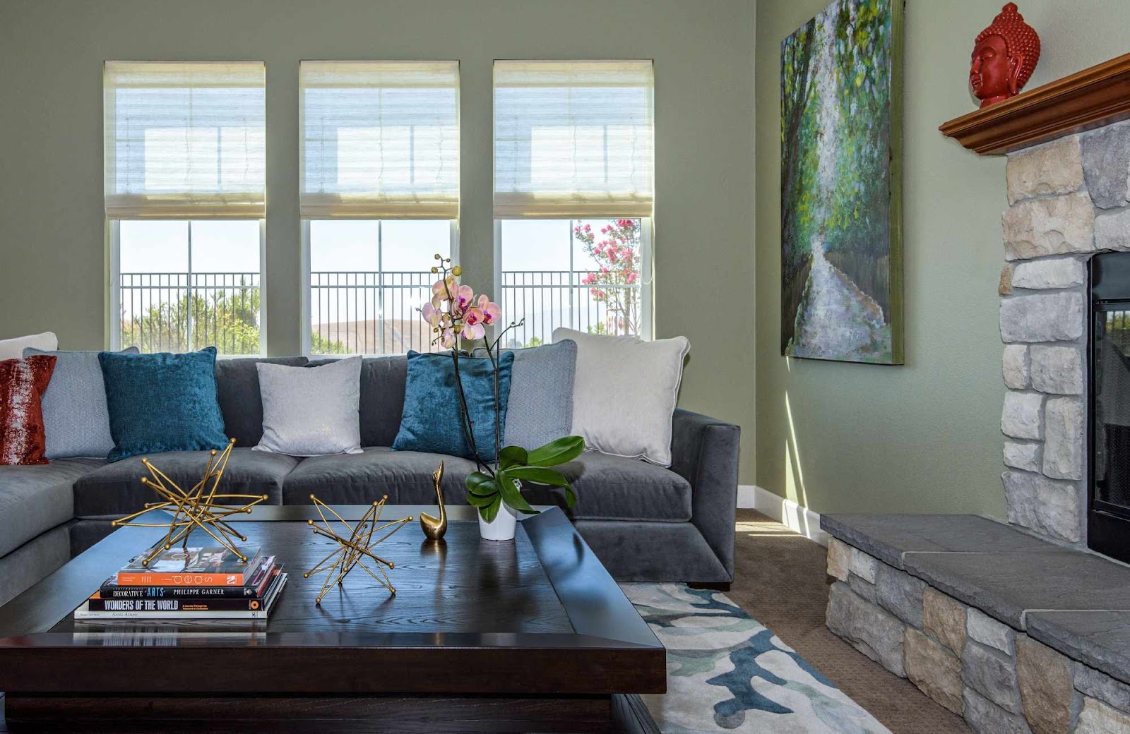 raashi-design-walnut-creek-ca-window-treatments-to-enhance-design-welcoming-living-room-wiht-grey-sectional-and-three-windows-with-roman-shades