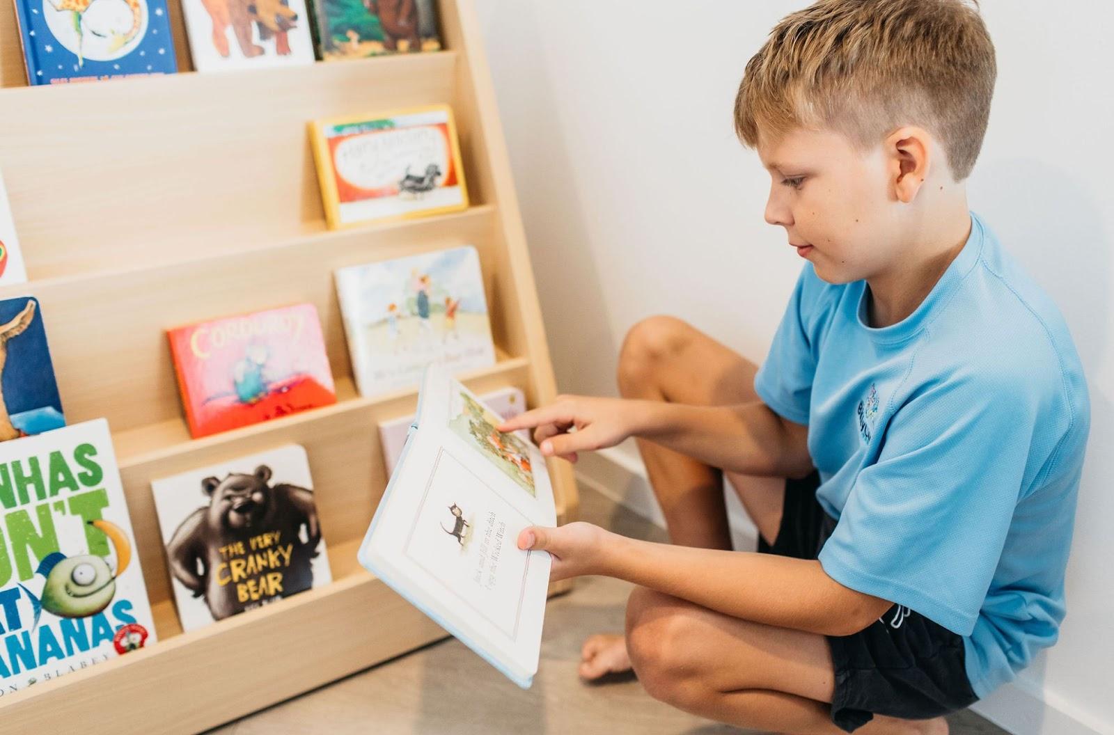 A child reading a book with dyslexia